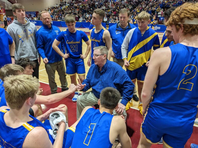 Castlewood coach Paul Raasch visits with his team Thursday, March 16 at the State B Boyd basketball tournament in the Barnett Center. Raasch previously coached at Langford for 17 years. Aberdeen Insider photo by Scott Waltman