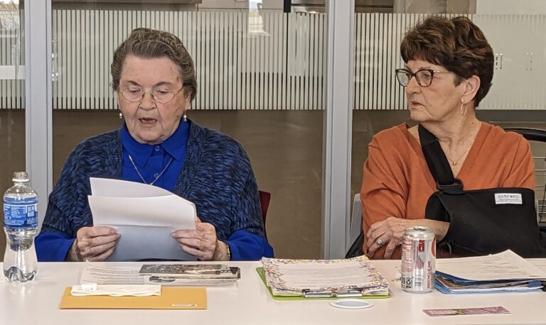Hedi Swanhorst, left, shares her story about being a young person in Germany while Hitler and the Nazis were in power, as Sharon Osborne listens. Aberdeen Insider photo by Scott Waltman