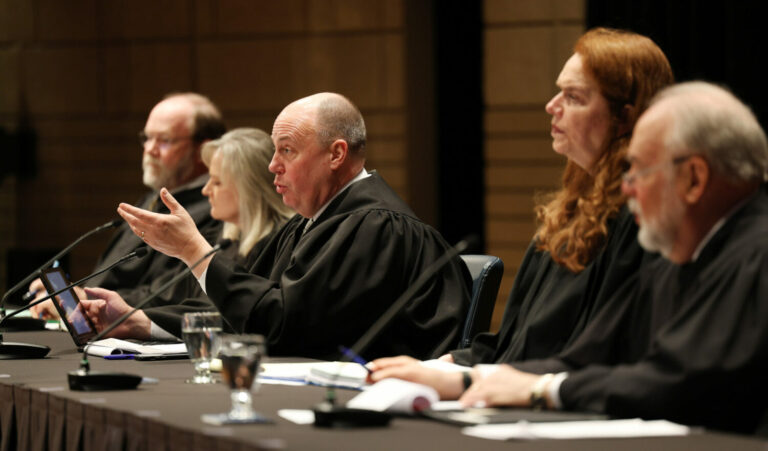 South Dakota Chief Justice Steven Jensen gestures as he participates in oral arguments with other state Supreme Court justices on March 23, 2023, in Brookings. South Dakota Newspaper Association photo by Dave Bordewyk