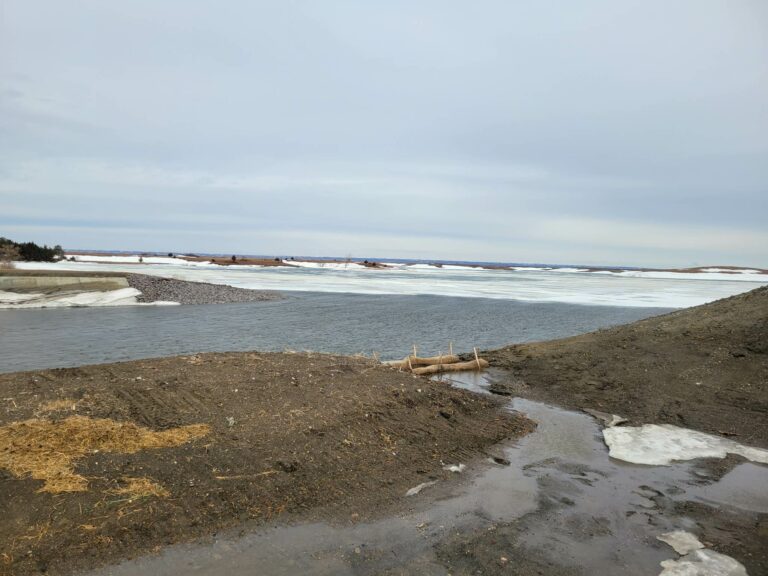Water was running over the Elm Lake spillway Friday morning. Flooding has led to some underwater roads in the county. Photo courtesy of Brown County Emergency Management