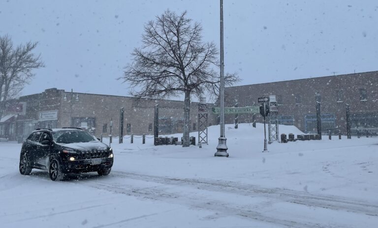 Traffic in downtown Aberdeen as snow falls on Friday, April 1. Aberdeen got 10 inches of snow in the story. Aberdeen Insider photo by Troy McQuillen