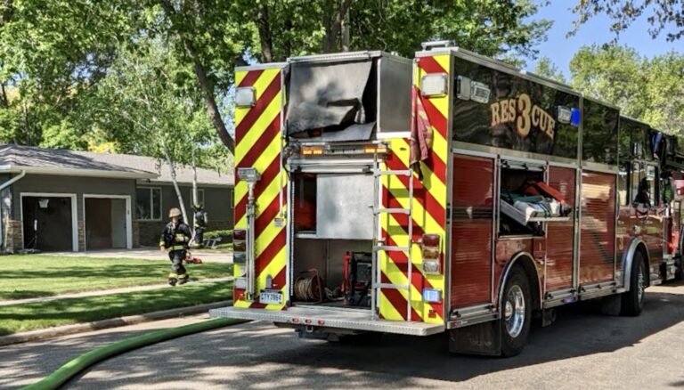 Smoke flows out of a garage after a fire was reported in the 500 block of 19th Avenue Northeast the morning of Friday, May 26. Aberdeen Insider photo by Scott Waltman
