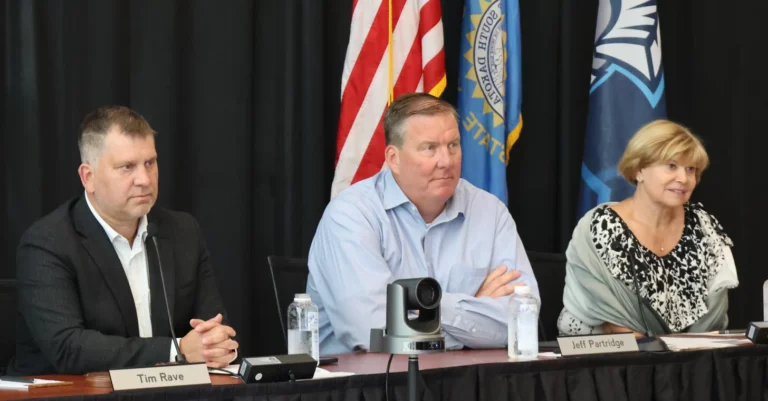 Board of Regents President Tim Rave, Vice President Jeff Partridge and Regent Pam Roberts listen as legislative leaders discuss their approach to working with the regents. Dakota Scout photo by Joe Sneve