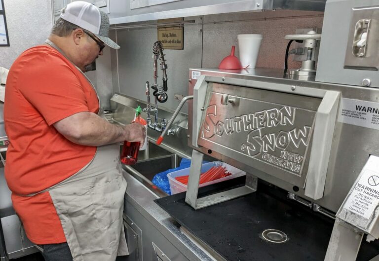 Marc Runnels prepares a sno-ball at Pop's Bayou Mama's food truck on Monday, June 26. The food truck is set to open Saturday, July 1. Aberdeen Insider photo by Scott Waltman