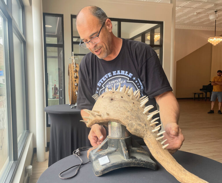 Steve Bormes has a few pieces of art set up in the windows of the Engels Event Co. in July. The illuminated pieces will be visible in the evening as well until mid-July. Aberdeen Insider photo by Elisa Sand