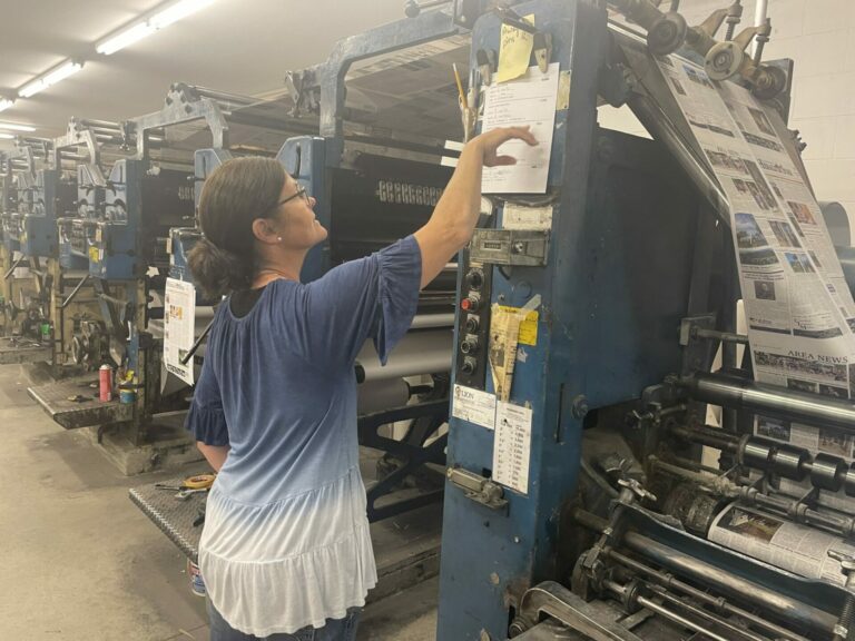 Mandy Scherer, owner/publisher of the Bennett County Booster and four other weekly papers, runs the operation from her main office in Martin, S.D., where the press runs every Tuesday. South Dakota News Watch photo by Bart Pfankuch