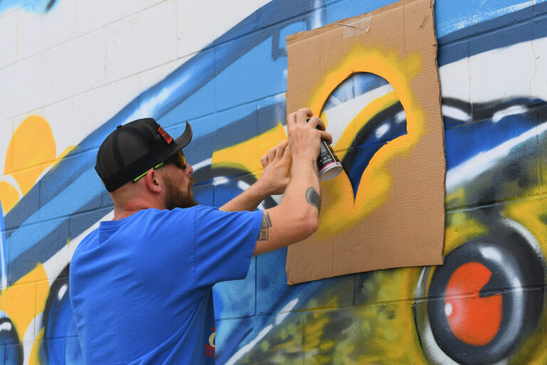 Street artist Brian O'Mearlaigh started working on this painting on the east side of the Jarman Water building on South Fifth Street. Work started on June 22, He was busy painting on Tuesday, June 27. Aberdeen Insider photo by Elisa Sand