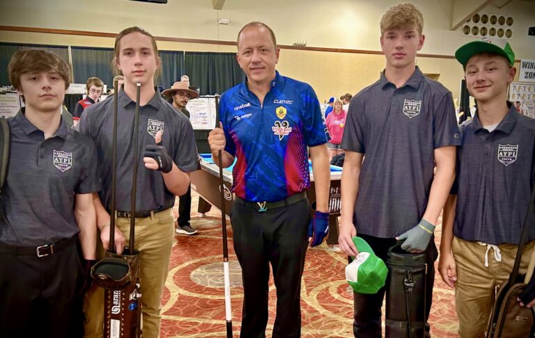 Aberdeen Youth Pool League members, from left, James Schuck, August Bobby, Ari Fischer, and Parker Flack pose with Shane Van Boening during the International Junior Pool Championships in July. Van Boening, who is from Rapid City, is considered the best pool player in the world. Courtesy photo