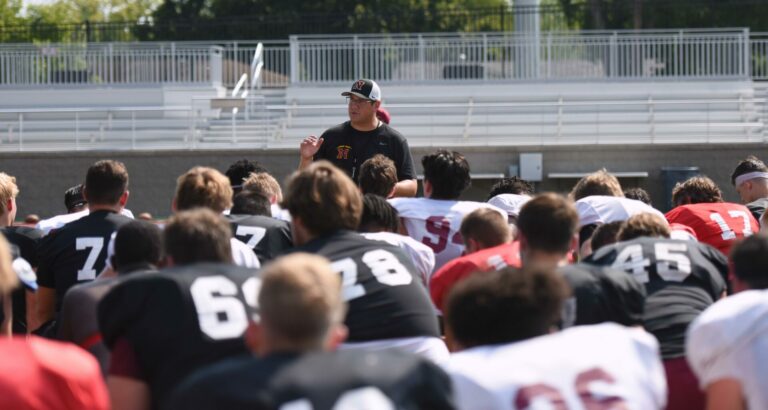 Northern State University football coach Mike Schmidt addresses players during a 2023 practice. Photo by Robb Garofalo