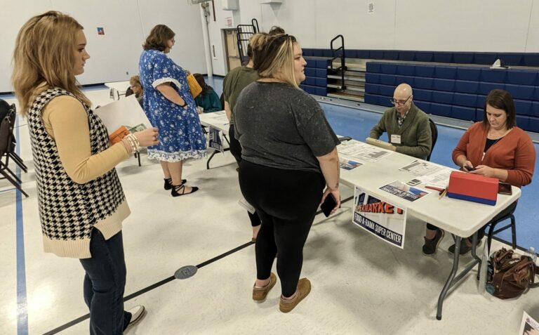 People who participated in a poverty simulation on Wednesday, Sept. 27 wait in line to get products from the grocery store. Aberdeen Insider photo by Scott Waltman