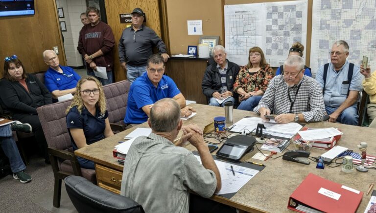 Kylie Lange, left, of Summit Carbon Solutions, and Jim Seurer of Glacial Lakes Energy visit with the Brown County Commission on Tuesday, Sept. 26. Aberdeen Insider photo by Scott Waltman