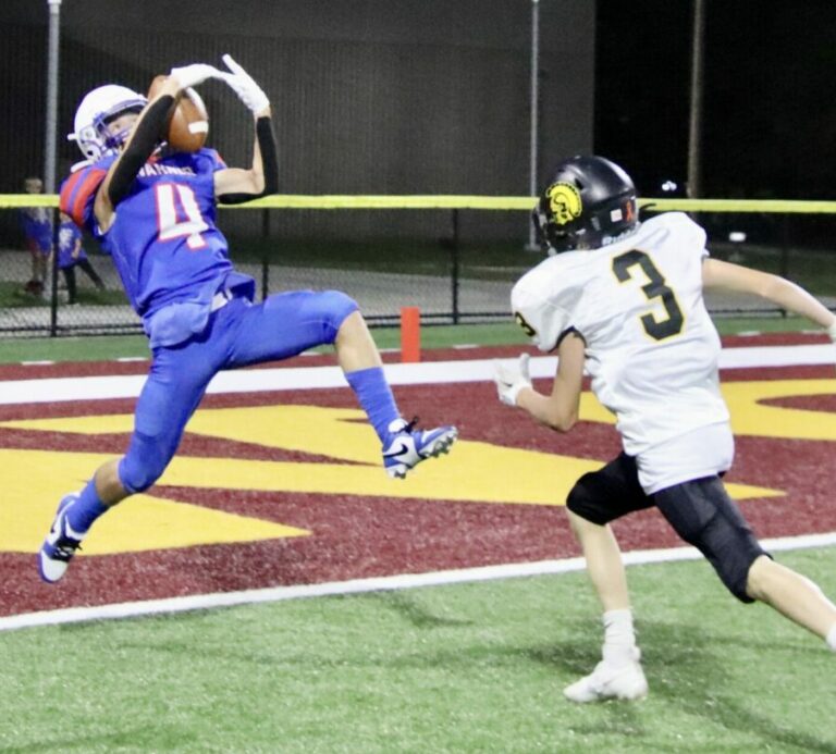 Warner's Josiah Baum catches a touchdown pass from quarterback Hunter Cramer in the Monarchs' 27-20 win over Faulkton on Friday, Sept. 22 at Dacotah Bank Stadium. In coverage for Faulkton is Gian DiMaria. Aberdeen Insider photo by Scott Waltman
