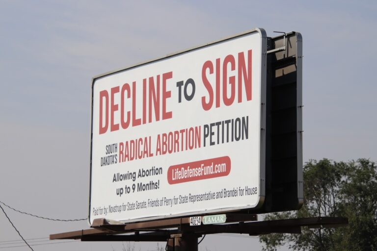 This billboard on the west side of the Second Street overpass has some people claiming it's deceptive. Aberdeen Insider photo by Scott Waltman
