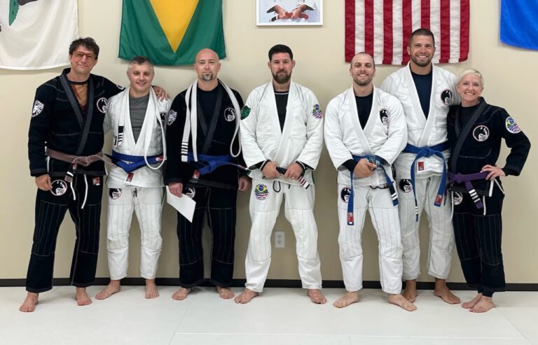 Four Aberdeen police officers were among those honored with blue belts at a Wolfpack Family Jiu-Jitsu ceremony on Sept. 8. From left are Wolfpack Family Jiu-Jitsu coach Joshua Citrak; officer Mark Miller, blue belt; officer Michael Bunke, blue belt; Matheus Colhado, a black belt who presented the belts; officer Zach Krage, blue belt second-degree; officer Kyle Fadness, blue-belt third degree, and Wolfpack Family Jiu-Jitsu coach Susan Citrak. Courtesy photo
