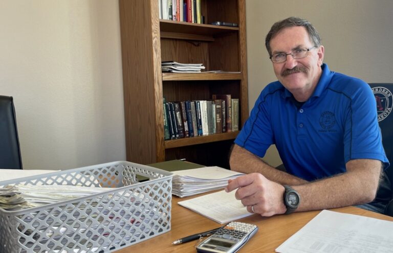 New Aberdeen City Manager Robin Bobzien poses for a picture behind his desk at city hall. He started the job earlier this month. Aberdeen Insider photo by Elisa Sand