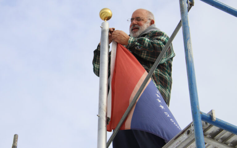 Exchange Club member Don Peck takes down one of the state flags in the Circle of Flags at Wylie Park on Saturday, Oct. 28. The Exchange Club sets up the flags in the spring and takes them down in the fall. All the flags are retired and replaced in the spring. Aberdeen Insider photo by Elisa Sand