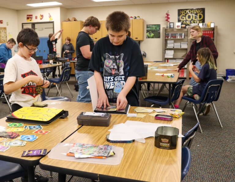 Simmons Middle School students Tony Abeyta, left, and Hunter Gutierrez look through their cards during a recent meeting of the Simmons Middle School Trading Card Club. Courtesy photo from the Aberdeen Public School District