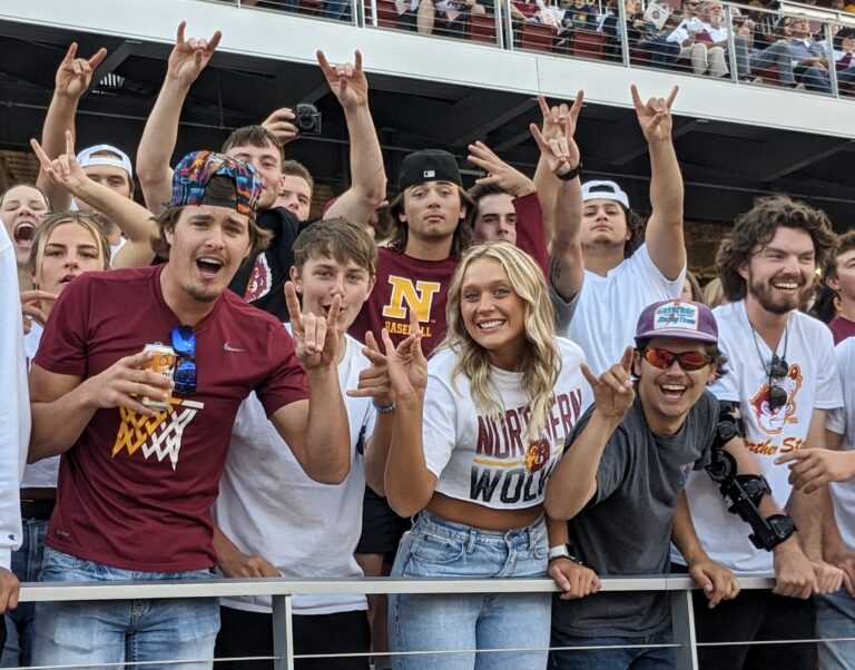 Northern State University fans celebrate during the Wolves season opener against the University of Mary earlier this season at Dacotah Bank Stadium. Aberdeen Insider photo by Scott Waltman