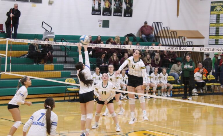 Roncalli's Ava Hanson hits through the block attempt of Tiospa Zina's Jaia Bursheim during their Region 1A volleyball match. Aberdeen Insider photo by Robb Garofalo