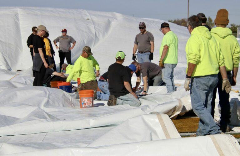 Workers help put the dome up on the former Presentation College campus on Monday, Oct. 16. The city is buying the dome from the Presentation Sisters. Aberdeen Insider photo by Scott Waltman