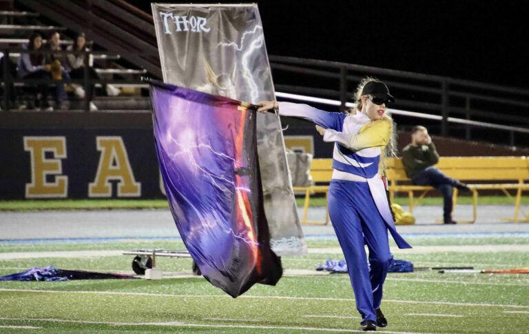 Aberdeen Central High School senior Caramia Estes performs in the color guard during a home football game. Aberdeen Insider photo by Scott Waltman.