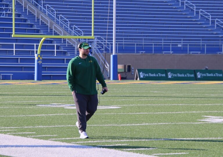 Gavin Heier tests the headsets for North Dakota State University prior to the Dakota Marker football game against South Dakota State University Saturday, Nov. 4 in Brookings. Aberdeen Insider photo by Robb Garofalo