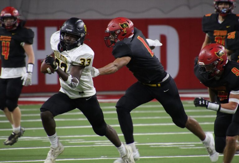 Running back Garrett Cramer of Faulkton picks up yardage against Avon during the Class 9B high school football championship game against Avon on Thursday, Nov. 9 at the DakotaDome in Vermillion. Avon turned back a Faulkton scoring drive in the closing minutes to win 32-30. Aberdeen Insider photo by Robbb Garofalo