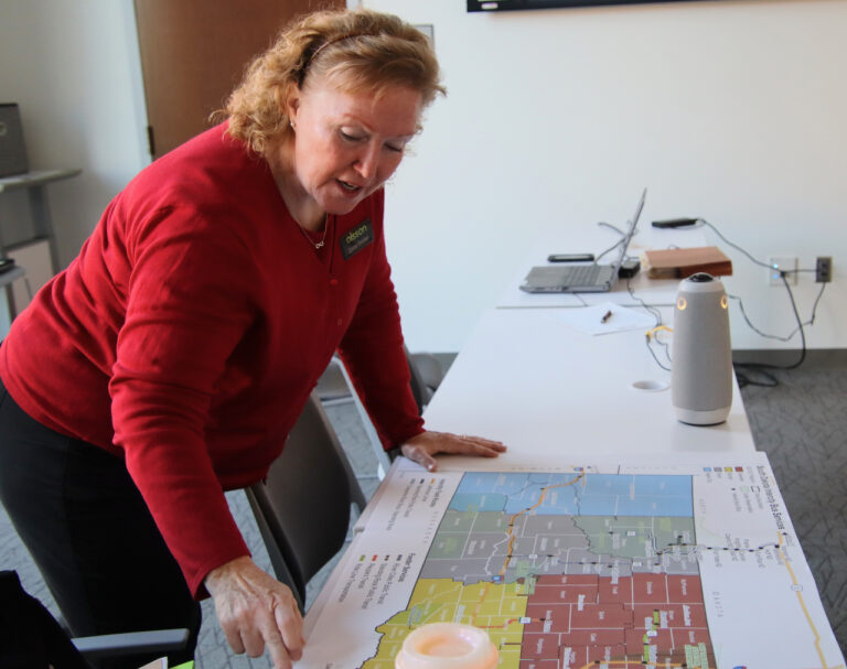 Corinne Donahue, senior planner for Olsson points to regions of South Dakota during a statewide intercity bus study meeting in Aberdeen on Wednesday, Nov. 1 at the K.O. Lee Aberdeen Public Library. Aberdeen Insider photo by Elisa Sand