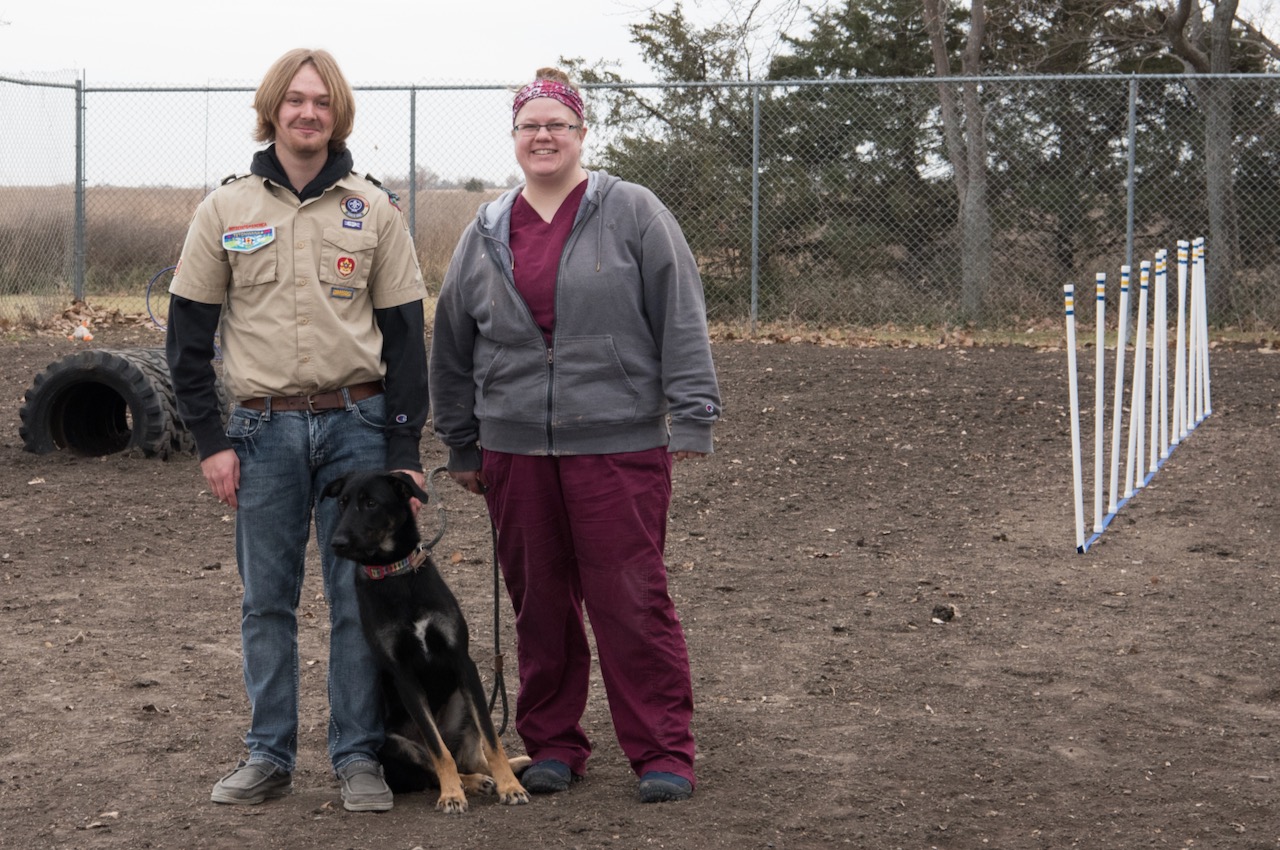 Jacob Stulken stands with Elaine Schaible from the Aberdeen Area Humane Society in the agility course area he developed for an Eagle Scout project. Courtesy photo