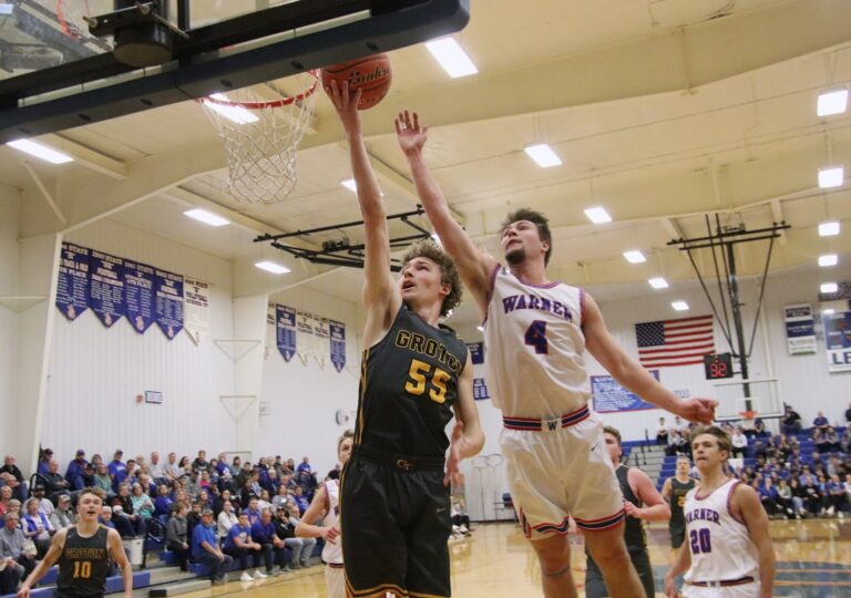 Groton Area's Teylor Diegel drives past Warner's Hunter Cramer during their game Tuesday, Jan. 2 in the Warner Gym. Aberdeen Insider photo by Robb Garofalo