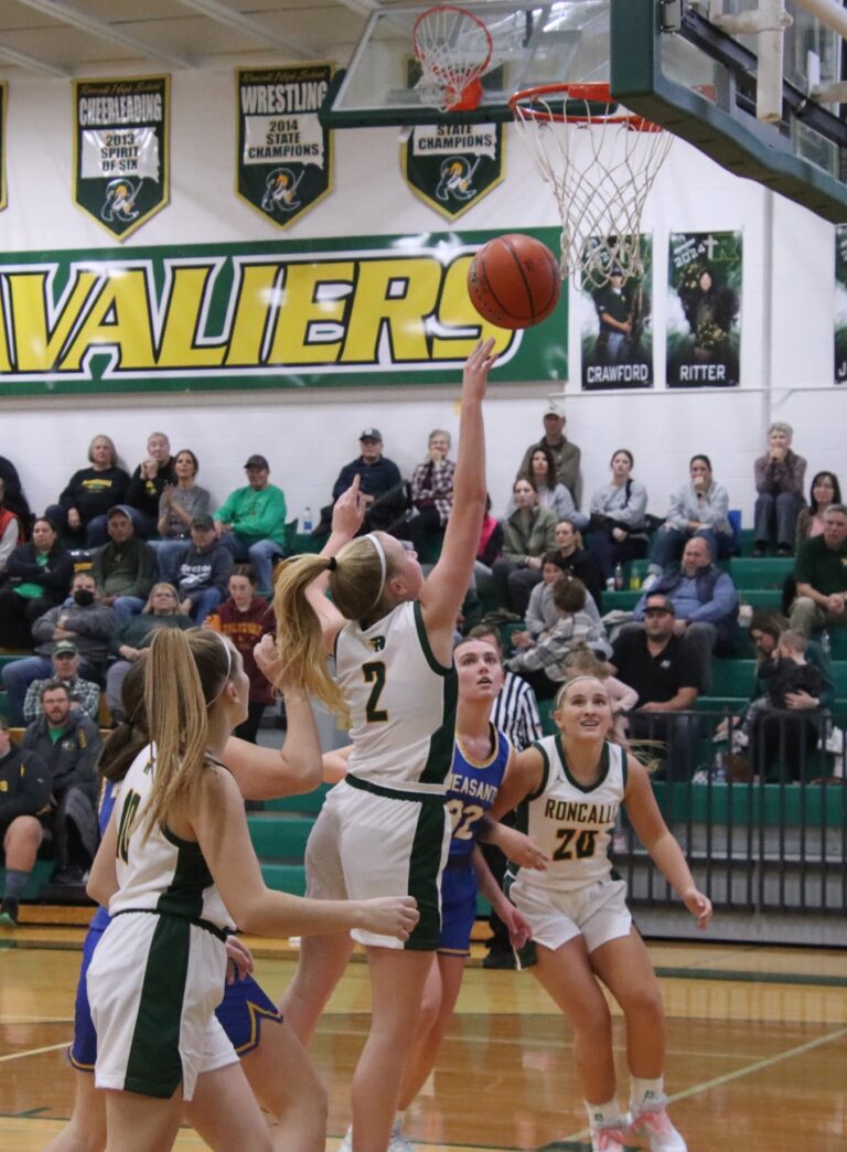 Aberdeen Roncalli's McKenna O'Keefe drives and scores a layup during the Cavaliers game against Redfield. Aberdeen Insider photo by Robb Garofalo