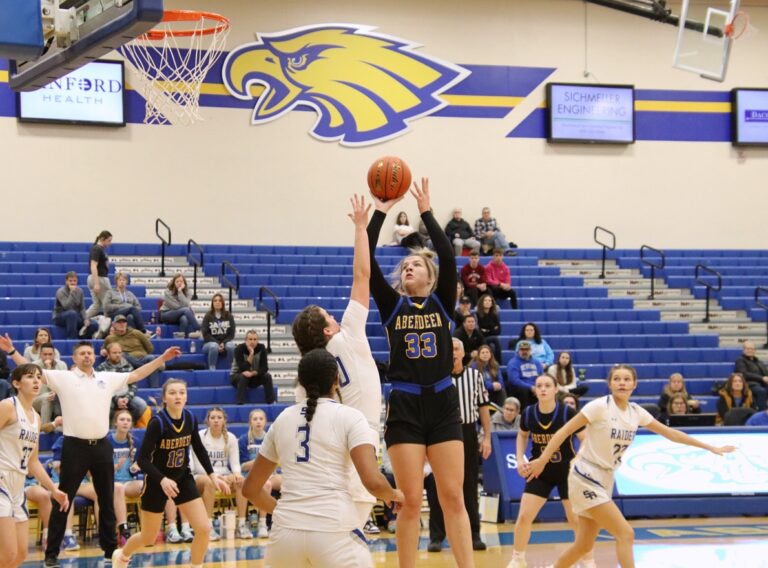 Aberdeen Central's Lauren Burckhard takes a jump shot over Rapid City Stevens' Isabell Higgins during their game Saturday, Dec. 9 in Golden Eagles Arena. Aberdeen Insider photo by Robb Garofalo