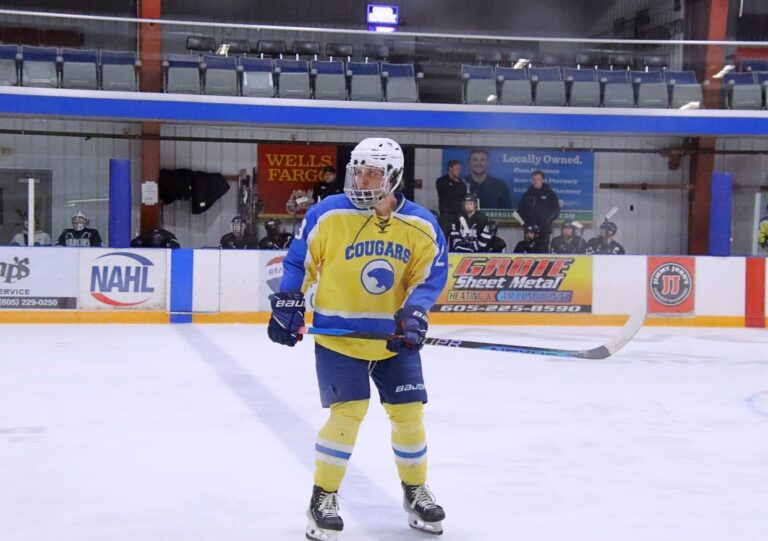 Aberdeen Cougars defenseman Jaxon Danielson watches play in the Cougars' offensive zone during the first period of their game against Mitchell Saturday, Dec. 8 in the Odde Ice Center. His brother Landon surprised him during a Dec. 3 after being deployed to Kuwait. Aberdeen Insider photo by Robb Garofalo