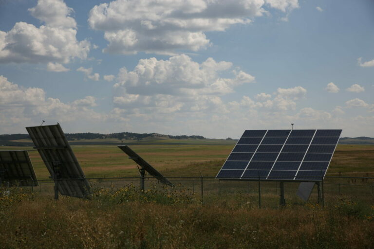 Solar panels stand near the Pine Ridge Indian Health Service in Pine Ridge. South Dakota Searchlight phot by Makenzie Huber
