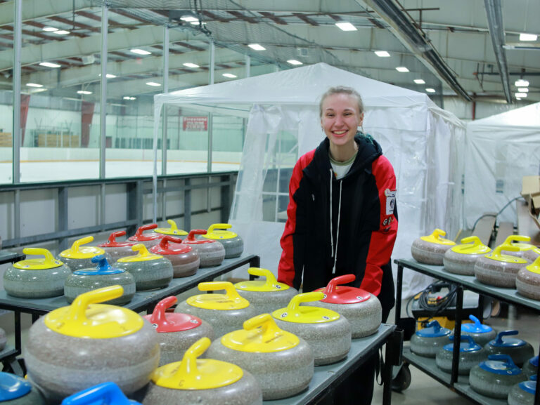 Elizabeth Wolfgram helps prepare the ice ahead of a curling league on Wednesday, Jan. 3 at the Holum Expo Building. Aberdeen Insider photo by Symmone Gauer