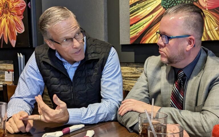 U.S. Sen. John Thune, R-S.D., visits with Mike Bockorny, CEO of the Aberdeen Development Corp., during lunch at Three22 on Thursday, Dec. 4. Aberdeen Insider photo by Scott Waltman
