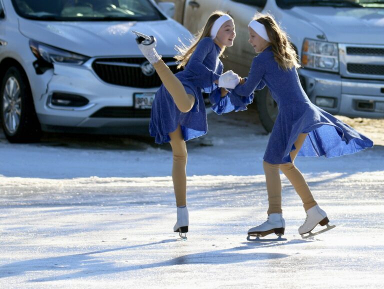 Specialty act performers Ryan and Tevan Hanson spin together during the Sunday afternoon Carnival of Silver Skates performance at the outdoor ice skating rink in Groton. Photo by Elizabeth Varin
