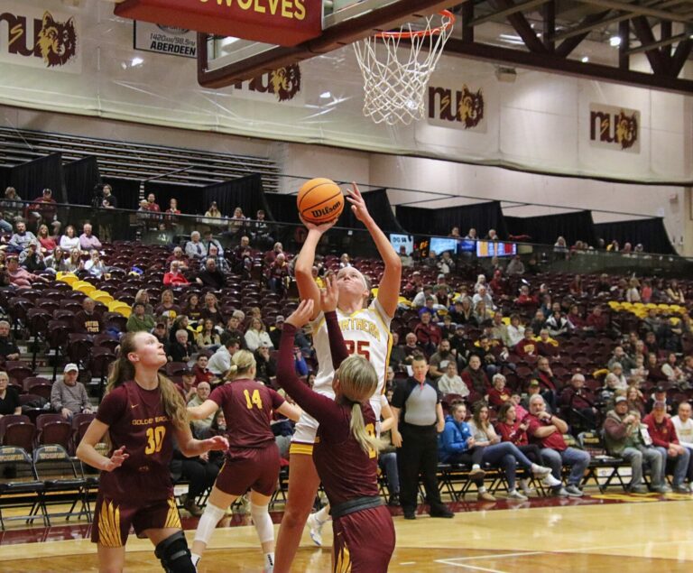 Northern State's Brynn Alfson takes a jump shot over Minnesota-Crookston's Hope Dudycha during the third quarter Saturday, Feb. 10 inside Wachs Arena. Aberdeen Insider photo by Robb Garofalo