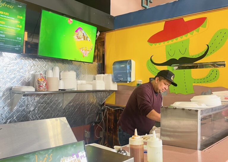 Enrique Sales fills an order at Dulces Tacos and Snacks, which opened Saturday, Feb. 17 at Uptown Aberdeen. Aberdeen Insider photo by Elisa Sand