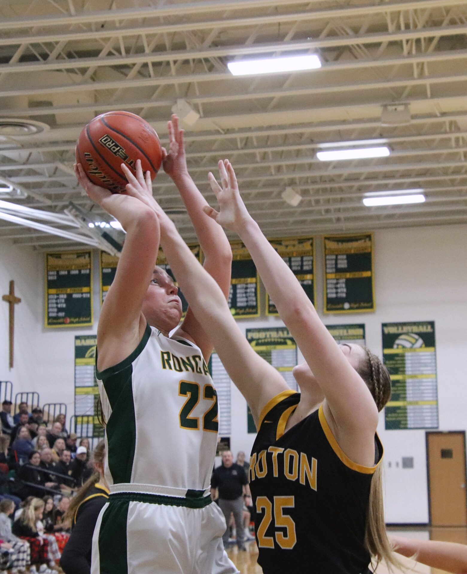 Aberdeen Roncalli's Ava Hanson takes a jump shot over Groton Area's Rylee Dunker during the third quarter of their Region 1A semifinal game Thursday, Feb. 22 inside the Roncalli Gym. Aberdeen Insider photo by Robb Garofalo