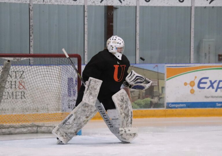 Aberdeen Cougars goalie Chloe Vikander deflects the puck for a glove save during practice Monday, Feb. 26 in the Odde Ice Center. Aberdeen Insider photo by Robb Garofalo
