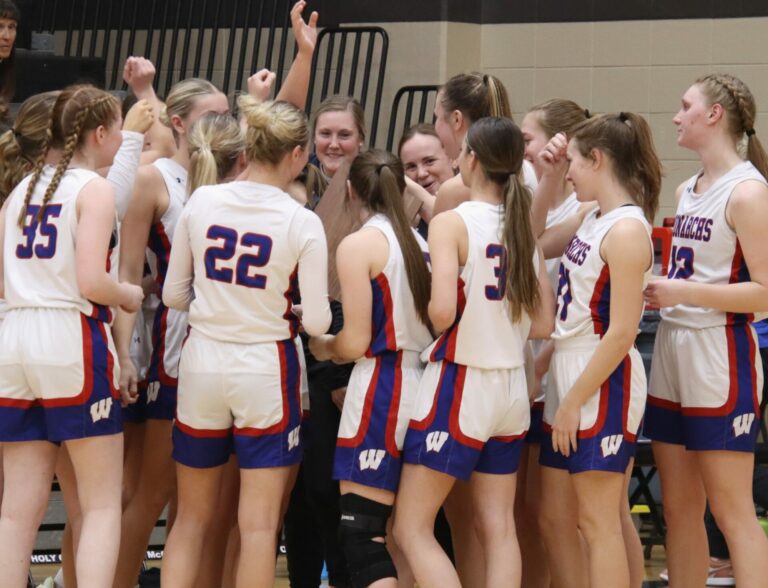 Members of the Warner Monarchs girls basketball team celebrate their SoDak 16 win over Herried/Selby Area Thursday, Feb. 29 in Ipswich. Aberdeen Insider photo by Robb Garofalo