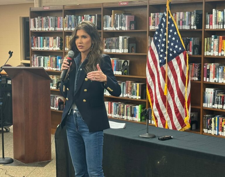 South Dakota Gov. Kristi Noem speaks March 13, 2024, at a town hall meeting at the high school in Mitchell, S.D. She confirmed recently meeting with Republican presidential nominee Donald Trump at Mar-a-Lago in Florida to discuss the possibility of her joining the 2024 ticket. South Dakota News Watch photo by Stu Whitney