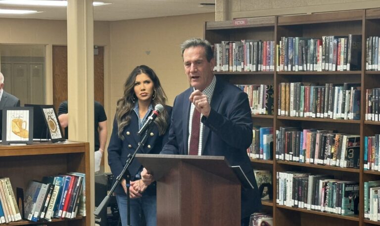 South Dakota Lt. Gov. Larry Rhoden, speaking March 13, 2024, at a town hall meeting in Mitchell, S.D., would likely assume more responsibilities if Gov. Kristi Noem were picked as Donald Trump's running mate. Noem (left) said that she would "still get to be governor" during the prospective campaign. South Dakota News Watch photo by Stu Whitney