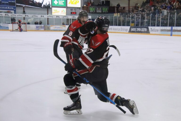 Leonid Bulgakov celebrates his second-period goal with teammate Nick Comfort (8) Saturday, April 6 at the Odde Ice Center. Aberdeen Insider photo by Robb Garofalo