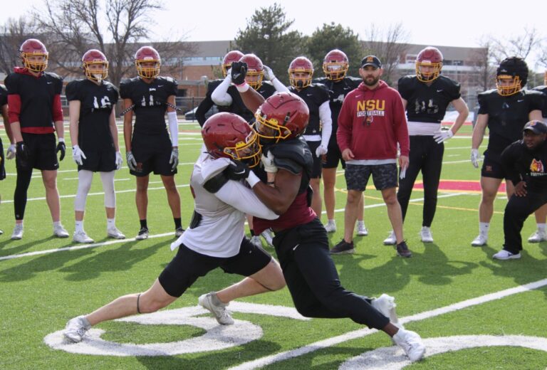 Northern State's Stanley Haskins, Jr., right, engages Trevor Johnson in a one-on-one drill during spring practice Friday, April 5. Aberdeen Insider photo by Robb Garofalo.