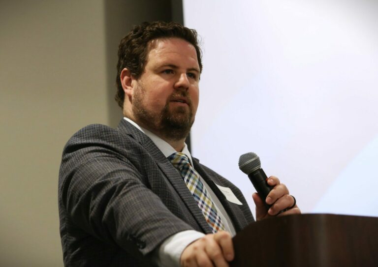 Economist and Dakota Institute CEO Jared McEntaffer presents economic data to the Governor’s Conference on Economic Development at the Sioux Falls Convention Center on April 10, 2024. South Dakota Searchlight photo by Joshua Haiar.