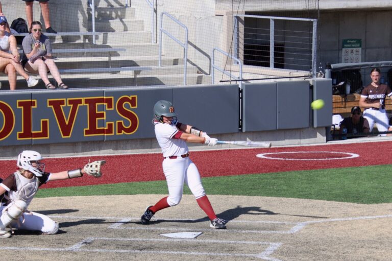 Northern State's Claire Zybult drives a pitch to right-center field during Game 2 against Southwest Minnesota State on Saturday, April 13 at Koehler Hall of Fame Field. Aberdeen Insider photo by Robb Garofalo