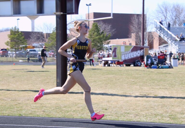Groton Area's Faith Traphagen runs the second leg of the girls 3,200-meter relay at the South Dakota National Guard Invitational Friday, April 12 at Milbank High School. Aberdeen Insider phot by Robb Garofalo