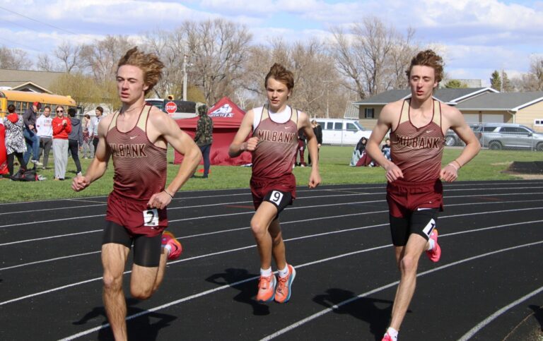 Milbank's James Batchelor, left, Ryan Wendland, and Payton Brown race in the 3200-meter run during the Rob Luecke Invitational Tuesday, April 23 at Groton Area High School. Aberdeen Insider photo by Robb Garofalo